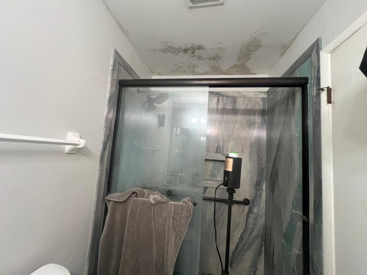 Air sampling pump set up in a bathroom